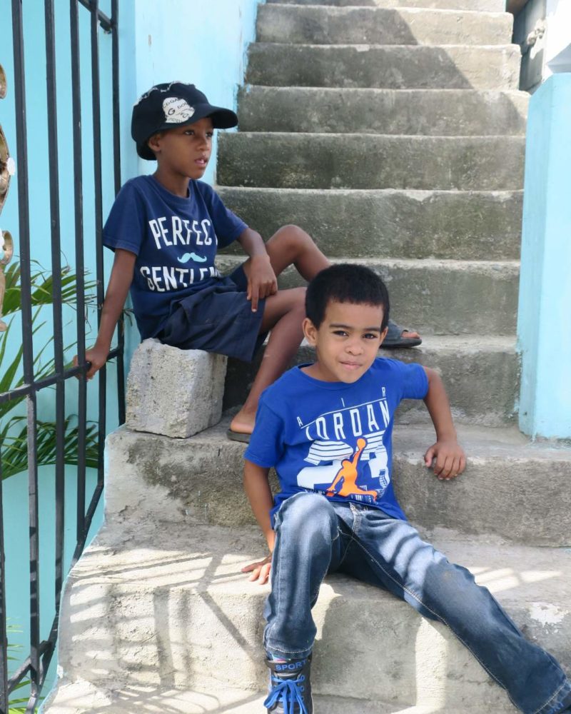 kids sitting on stairs outside