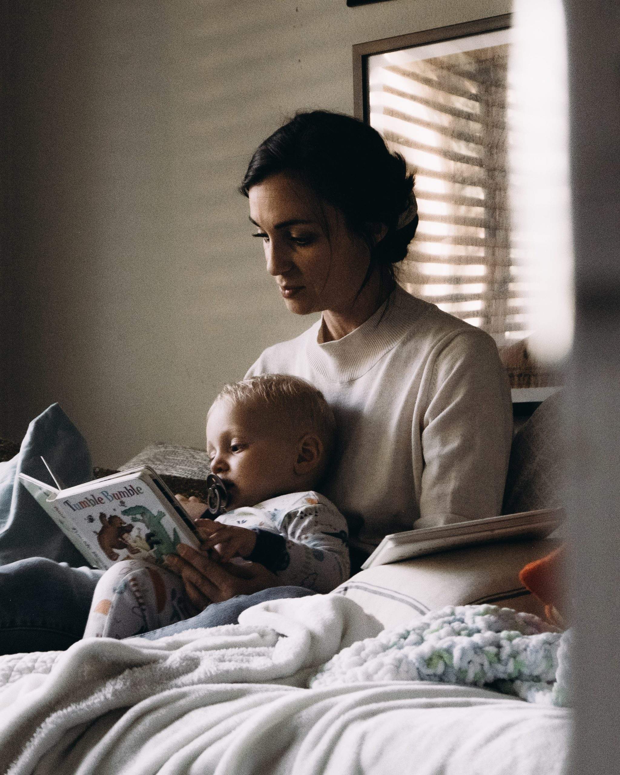 woman reading to baby